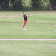 Meg tees off during practice round at state